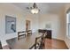 Formal dining room with dark wood table set and elegant chandelier lighting at 6317 Marbella Blvd, Apollo Beach, FL 33572