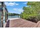 Wooden dock with electric hookups in a peaceful waterway lined with greenery at 6317 Marbella Blvd, Apollo Beach, FL 33572