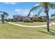 Beautifully landscaped front yard and paver driveway welcome you to this stunning home at 6317 Marbella Blvd, Apollo Beach, FL 33572