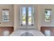 Bright foyer with double doors offering views of the lushly landscaped front yard at 6317 Marbella Blvd, Apollo Beach, FL 33572