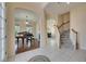 Spacious foyer leads to living spaces, stairs, and hardwood floors at 6317 Marbella Blvd, Apollo Beach, FL 33572