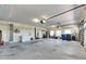 Spacious three car garage with shelving and lighting at 6317 Marbella Blvd, Apollo Beach, FL 33572
