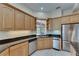 Corner view of kitchen features stainless appliances, granite countertops and ample cabinet space at 6317 Marbella Blvd, Apollo Beach, FL 33572