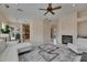 Spacious open living area with fireplace and access to the kitchen and dining area at 6317 Marbella Blvd, Apollo Beach, FL 33572