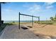 swing set with a calming ocean view and lush landscaping creating a serene play environment at 6317 Marbella Blvd, Apollo Beach, FL 33572