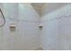 Tile shower featuring built-in soap dishes and decorative trim at 6317 Marbella Blvd, Apollo Beach, FL 33572