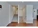 Bright staircase with carpeted steps, white banisters, and a wooden floor landing at 6317 Marbella Blvd, Apollo Beach, FL 33572