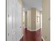 Clean hallway with hardwood floors and neutral-colored walls, creating a seamless transition at 700 S Harbour Island Blvd # 813, Tampa, FL 33602