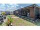 View of the screened-in lanai, backyard, shed, and fence at 7019 Wiseman Run Dr, Sun City Center, FL 33573