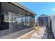 The screened-in lanai extends to backyard with a storage shed, offering convenient outdoor living and storage at 7019 Wiseman Run Dr, Sun City Center, FL 33573