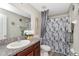 Well-lit bathroom featuring modern fixtures and a shower-tub combo at 7019 Wiseman Run Dr, Sun City Center, FL 33573