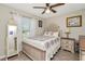 Serene bedroom featuring a comfortable bed, ample natural light, and tasteful decor at 7019 Wiseman Run Dr, Sun City Center, FL 33573