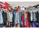 Walk-in closet featuring ample storage space with clothing racks and shelving, perfect for organization at 7019 Wiseman Run Dr, Sun City Center, FL 33573