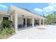 Spacious clubhouse patio with comfortable seating, offering a relaxing outdoor space for community gatherings at 7019 Wiseman Run Dr, Sun City Center, FL 33573
