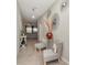 Stylish entryway featuring decorative accents, tile floors, and a glimpse into the living area at 7019 Wiseman Run Dr, Sun City Center, FL 33573