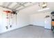 Well-maintained garage with ample space, epoxy flooring, and organized storage solutions, ideal for vehicle parking at 7019 Wiseman Run Dr, Sun City Center, FL 33573