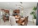 Eat-in kitchen featuring a breakfast bar, stainless steel appliances, and an adjacent dining area with modern decor at 7019 Wiseman Run Dr, Sun City Center, FL 33573