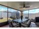 Screened lanai with a dining table, chairs, ceiling fan and backyard view with a shed at 7019 Wiseman Run Dr, Sun City Center, FL 33573