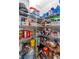 Walk-in pantry with wire shelving fully stocked with food and paper goods at 7019 Wiseman Run Dr, Sun City Center, FL 33573