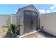 Durable backyard storage shed with double doors, offering ample space for storing outdoor equipment and tools at 7019 Wiseman Run Dr, Sun City Center, FL 33573