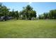 Recreational field with a soccer net, home, and storage in the background at 7040 Lumberton Rd, Zephyrhills, FL 33540