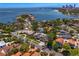 Stunning aerial view of waterfront homes, lush landscaping, and bay views at 720 Brightwaters Ne Blvd, St Petersburg, FL 33704