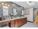 Bright bathroom with double vanity, stone countertops, ample storage, and an enclosed shower at 720 Brightwaters Ne Blvd, St Petersburg, FL 33704