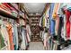 Walk-in closet with custom shelving for ample storage of clothes, shoes, and accessories at 720 Brightwaters Ne Blvd, St Petersburg, FL 33704