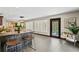 Open floor plan with an eat-in kitchen bar and glass door to the outdoor pool area at 720 Brightwaters Ne Blvd, St Petersburg, FL 33704