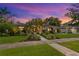 Beautiful single-story home with lush landscaping, lovely walkway, and a charming, inviting curb appeal at 720 Brightwaters Ne Blvd, St Petersburg, FL 33704