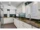 Kitchen featuring ample counter space, cabinetry, and a stainless steel sink at 720 Brightwaters Ne Blvd, St Petersburg, FL 33704