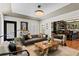 Spacious living room featuring a coffered ceiling, hardwood floors, and comfortable seating at 720 Brightwaters Ne Blvd, St Petersburg, FL 33704
