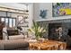 Stylish living room featuring a unique coffee table and fireplace at 720 Brightwaters Ne Blvd, St Petersburg, FL 33704