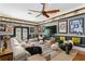 Comfortable living room with a large sectional sofa, TV, and sports memorabilia at 720 Brightwaters Ne Blvd, St Petersburg, FL 33704
