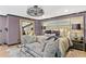 Stylish main bedroom features modern lighting, an upholstered headboard, and a full-length mirror at 720 Brightwaters Ne Blvd, St Petersburg, FL 33704