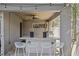 Charming outdoor bar area with a marble countertop and modern seating, ideal for entertaining guests at 720 Brightwaters Ne Blvd, St Petersburg, FL 33704