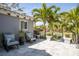 Inviting patio area with comfortable seating and lush greenery, perfect for outdoor relaxation and entertaining at 720 Brightwaters Ne Blvd, St Petersburg, FL 33704
