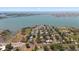 Scenic aerial view capturing a coastal neighborhood near waterfront, parks, and charming residences at 7909 Garden N Dr, St Petersburg, FL 33710
