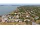 Picturesque aerial view of a waterfront neighborhood boasting a park, mature trees and water access at 7909 Garden N Dr, St Petersburg, FL 33710