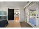 Primary bedroom with sliding glass doors, walk-out to a patio and open to the updated kitchen at 7909 Garden N Dr, St Petersburg, FL 33710