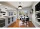 Cozy dining area with hardwood floors and a view of the backyard at 7909 Garden N Dr, St Petersburg, FL 33710