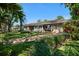 Beautiful single story home with a well-manicured lawn and a brick driveway at 7909 Garden N Dr, St Petersburg, FL 33710