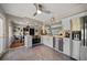 Modern kitchen with stainless steel appliances, white cabinets, and tile floors at 7909 Garden N Dr, St Petersburg, FL 33710
