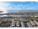 Wide aerial view showcasing waterfront homes along canals with stunning views of the Gulf and clear blue skies at 830 Pinellas Bayway S, St Petersburg, FL 33715