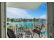 The balcony features a water view, furniture, and an awning at 830 Pinellas Bayway S, St Petersburg, FL 33715