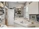 Bright bathroom with a large soaking tub and stylish decor at 830 Pinellas Bayway S, St Petersburg, FL 33715