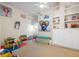 Bright bonus room with neutral walls and decor, lots of natural light, and storage space at 830 Pinellas Bayway S, St Petersburg, FL 33715