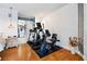 This exercise room has a treadmill, bicycle, and a view through to the main bathroom at 830 Pinellas Bayway S, St Petersburg, FL 33715