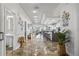 Bright and open living space seamlessly connecting the living room, dining area, and kitchen with ample natural light at 830 Pinellas Bayway S, St Petersburg, FL 33715