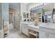 The main bathroom has dual sinks and a large mirror at 830 Pinellas Bayway S, St Petersburg, FL 33715